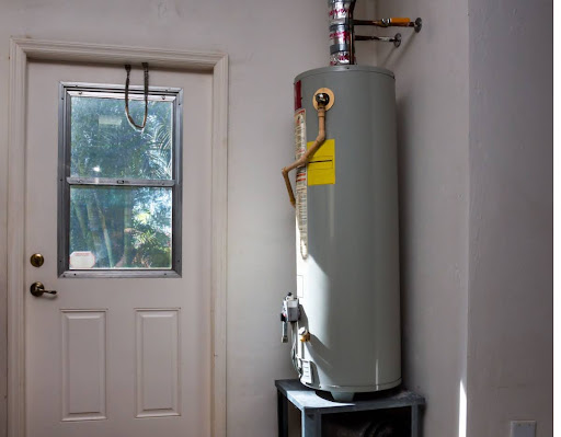 A water heater tank in a home.